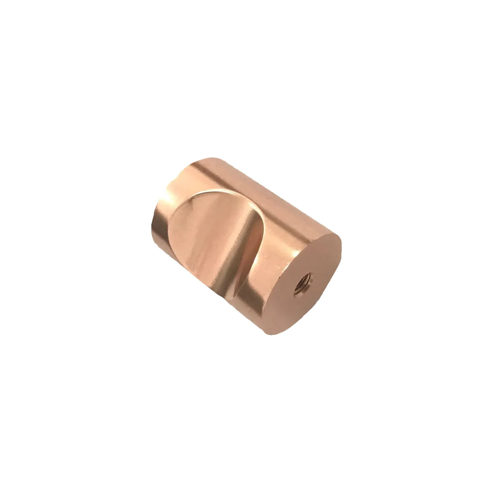 Angled view of a single rose gold cylindrical barrel cabinet knob with its circular finger scoop cut into the body