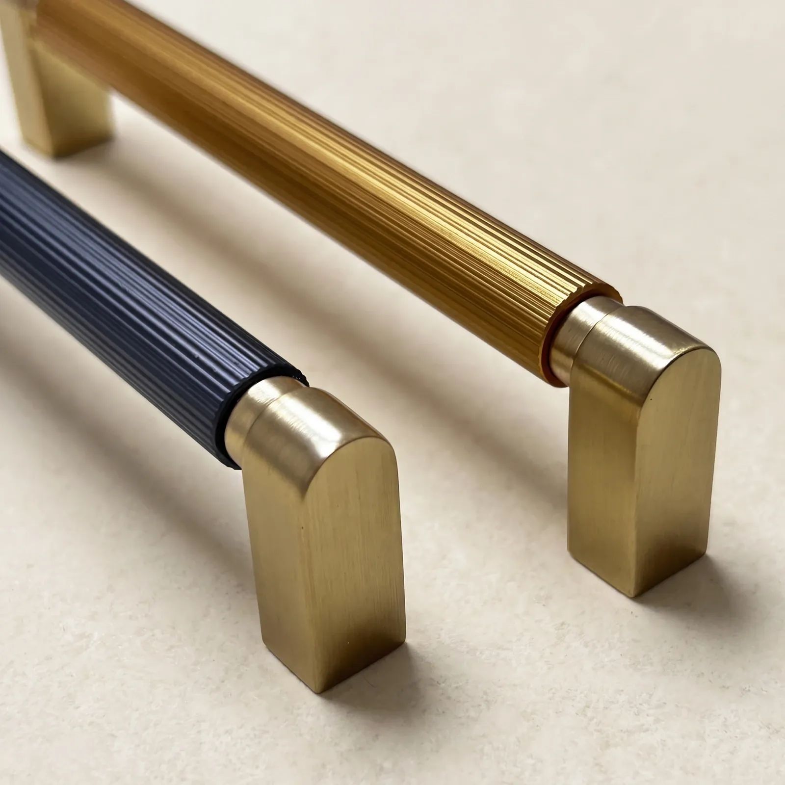 Close view of the grooved round grips and plain end blocks where the color-blocked D-profile pull bars meet their mounts