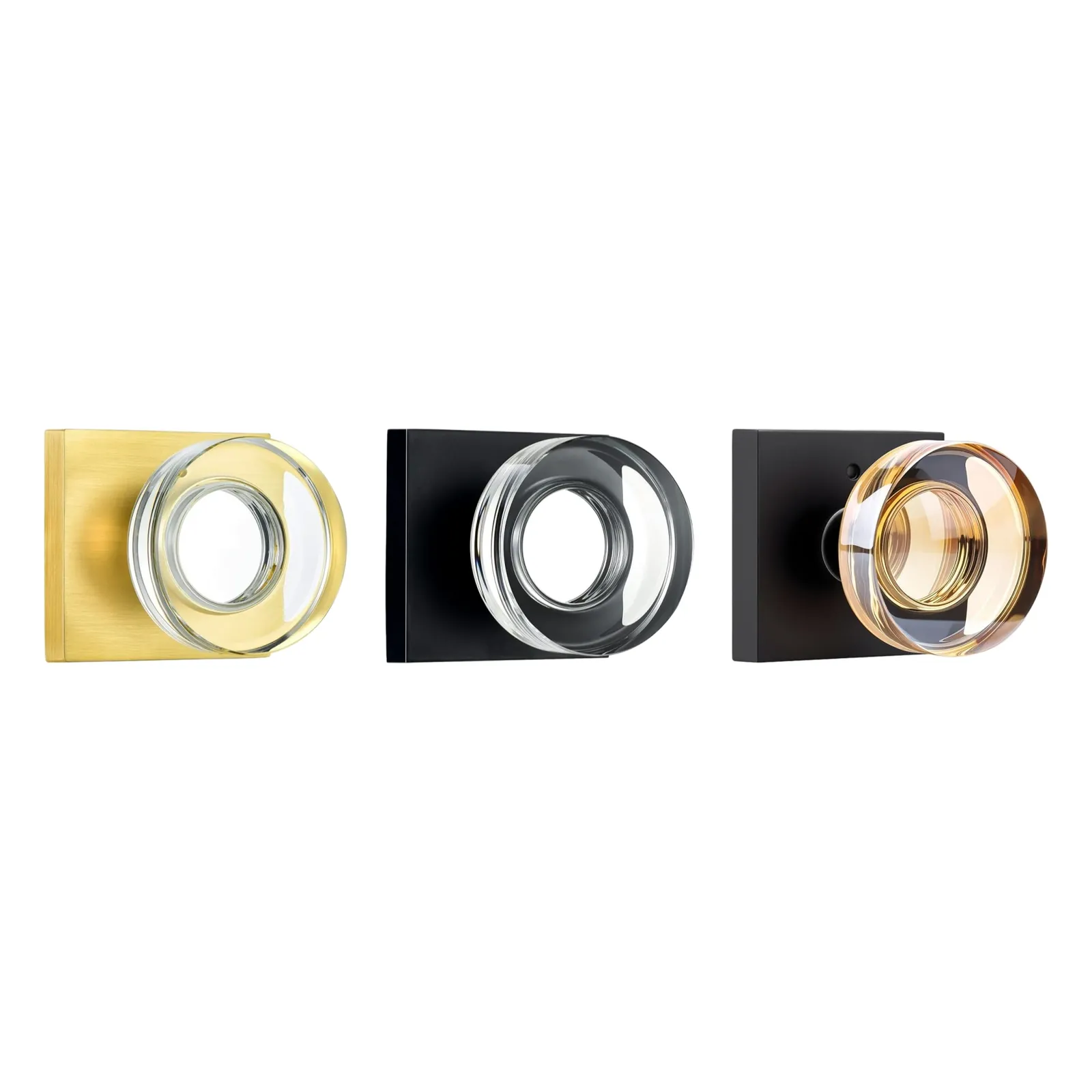 Angled view of square-rose crystal door knobs in brush gold, matt black, and champagne finishes on a white background