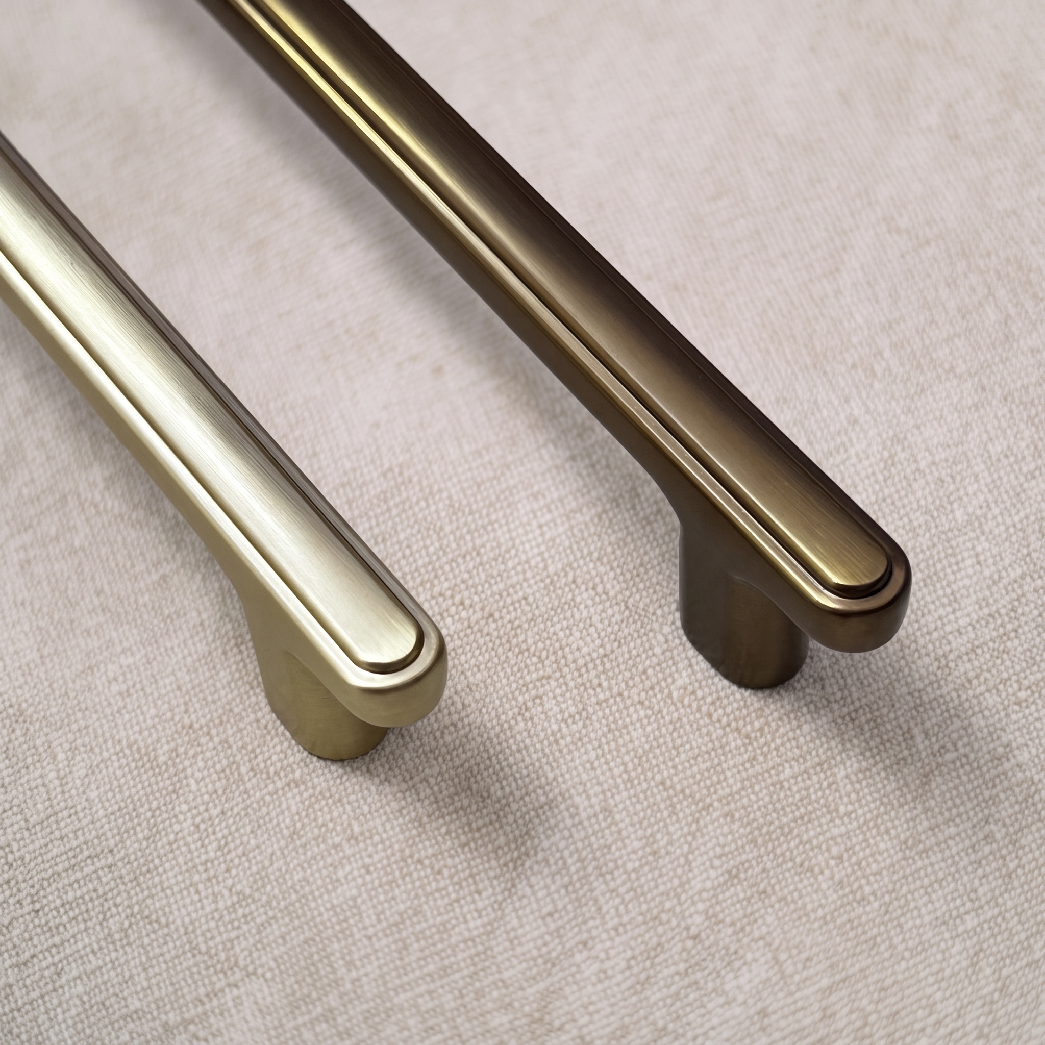 Close view of two ridge-top bridge pull ends showing the beaded ridge line and rounded bar