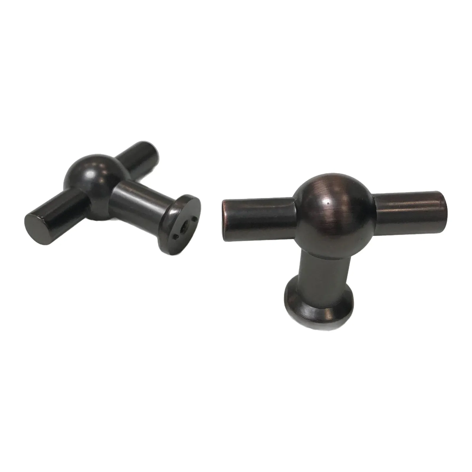 Angled view of a pair of oil-rubbed bronze T-shaped knobs, one lying to show the open crossbar ends and the round base ring, on a white background