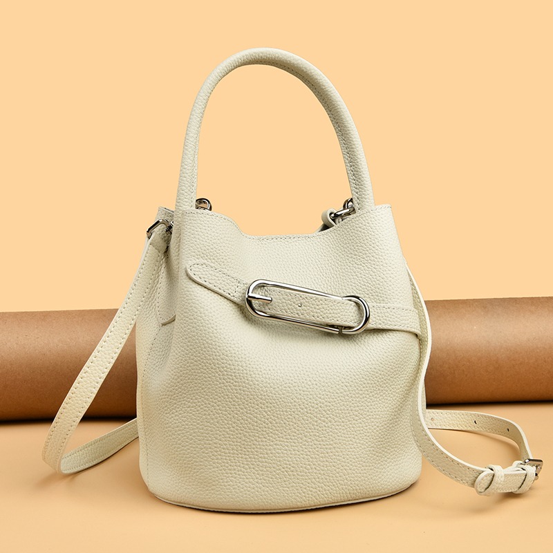 Custom Leather Bucket Bag – Drawstring Handbag with Metal Bar Detail (view 3) — custom leather bag manufacturing by Kaishi Bag Factory