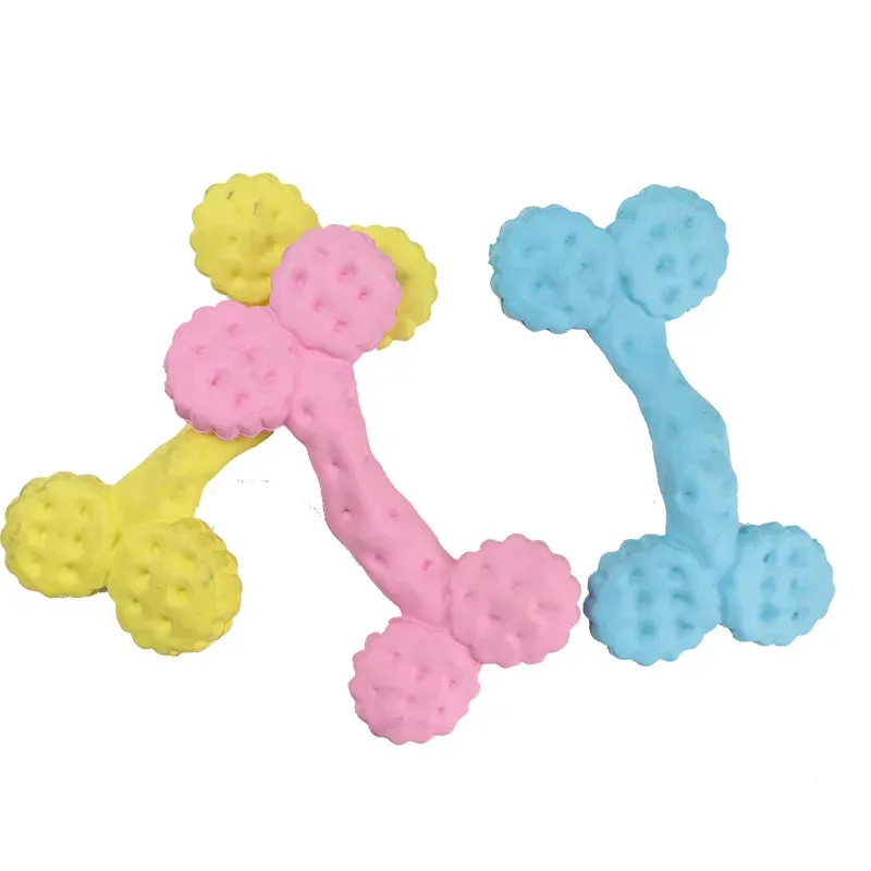 Three dotted bone-shaped squeaky dog toys in yellow, pink and light blue