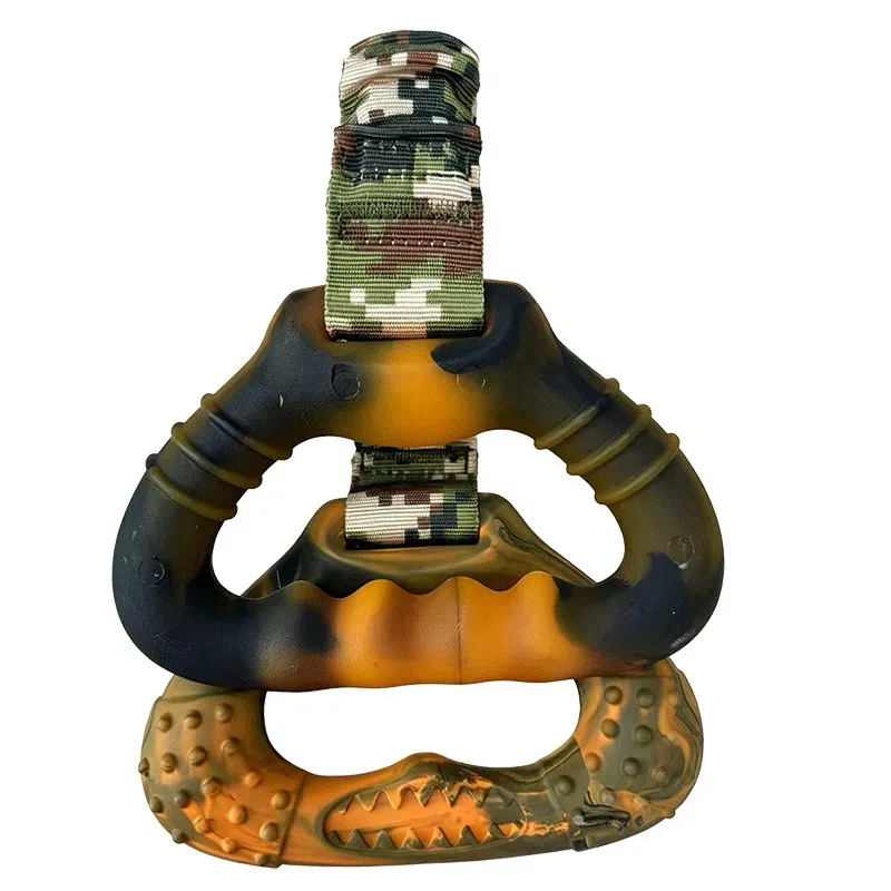 Orange and black rubber dog tug toy with camouflage strap and a textured rubber grip