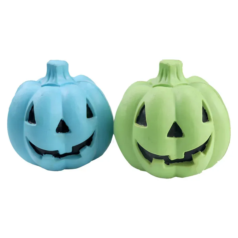 Two jack-o'-lantern pumpkin squeaky dog toys in blue and green