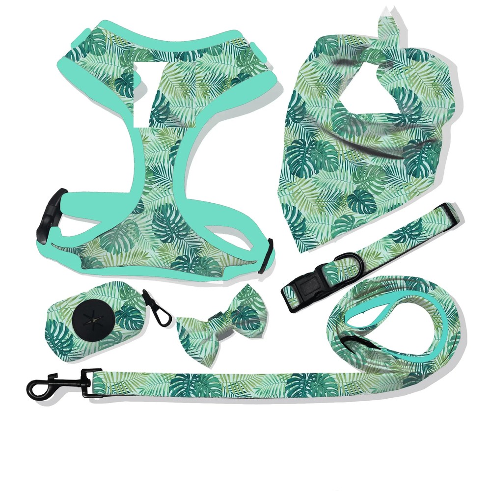 Teal tropical leaf-print dog harness set with bib, bow tie, leash and poop bag holder