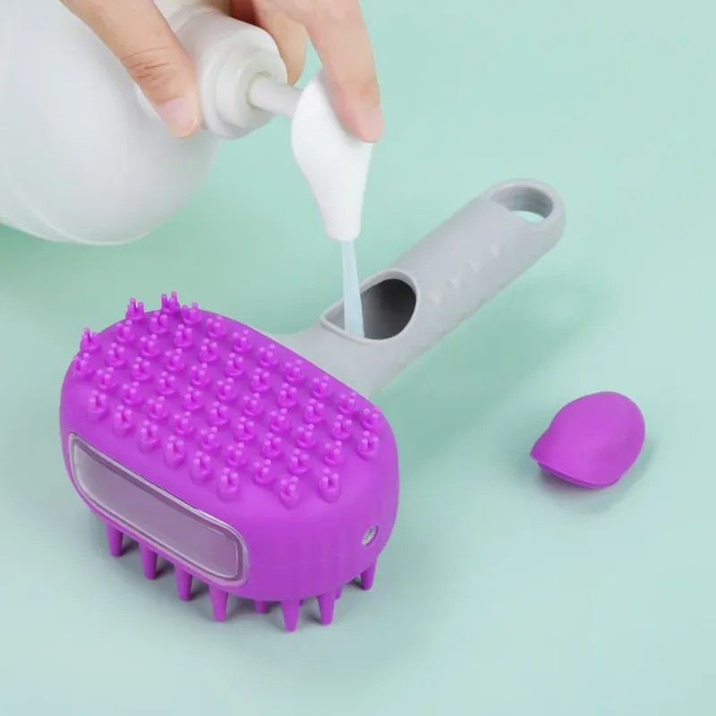 Purple silicone dog bath brush with shampoo dispenser being filled