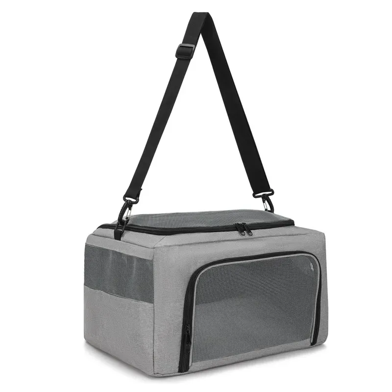 Grey pet carrier bag with a black shoulder strap and a mesh side window