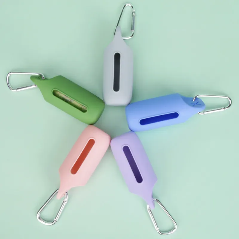 Silicone poop bag dispensers with carabiners in green, white, blue, pink and purple