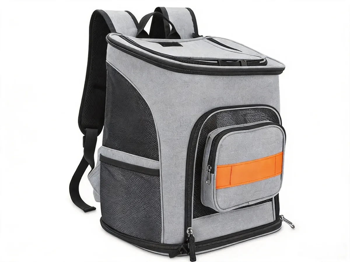 Grey foldable pet backpack carrier with mesh side panels and an orange reflective band on the front pocket