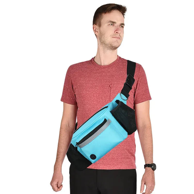 Man wearing the blue hands-free dog walking waist bag across his body