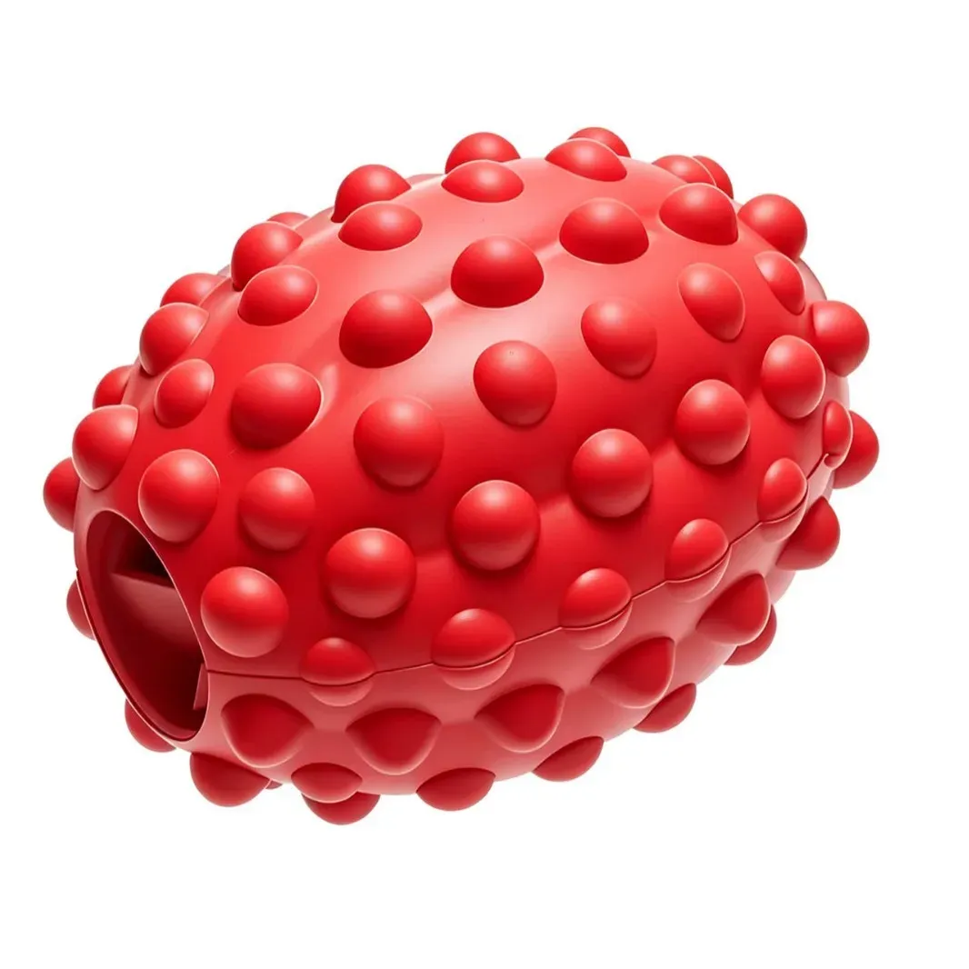 Red bumpy rugby ball treat-dispensing dog toy