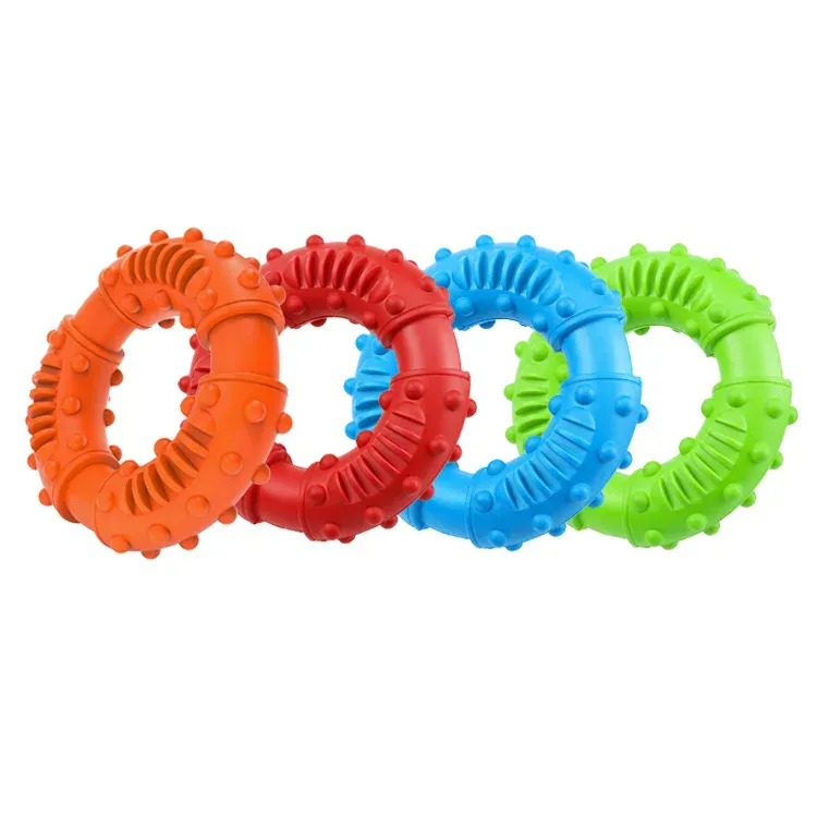 Four studded ring dog toys in orange, red, blue and green