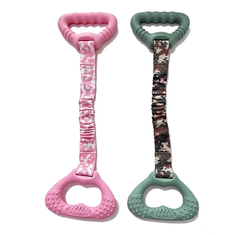 Pink and green rubber pull ring dog toys with patterned straps