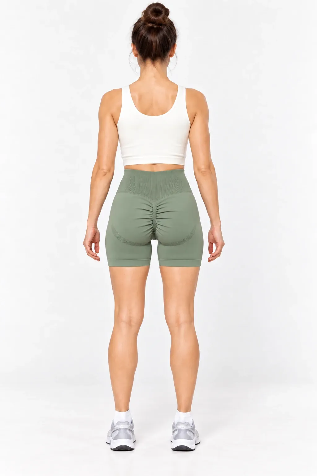 Women's olive green seamless biker shorts with center-back scrunch detail, back view
