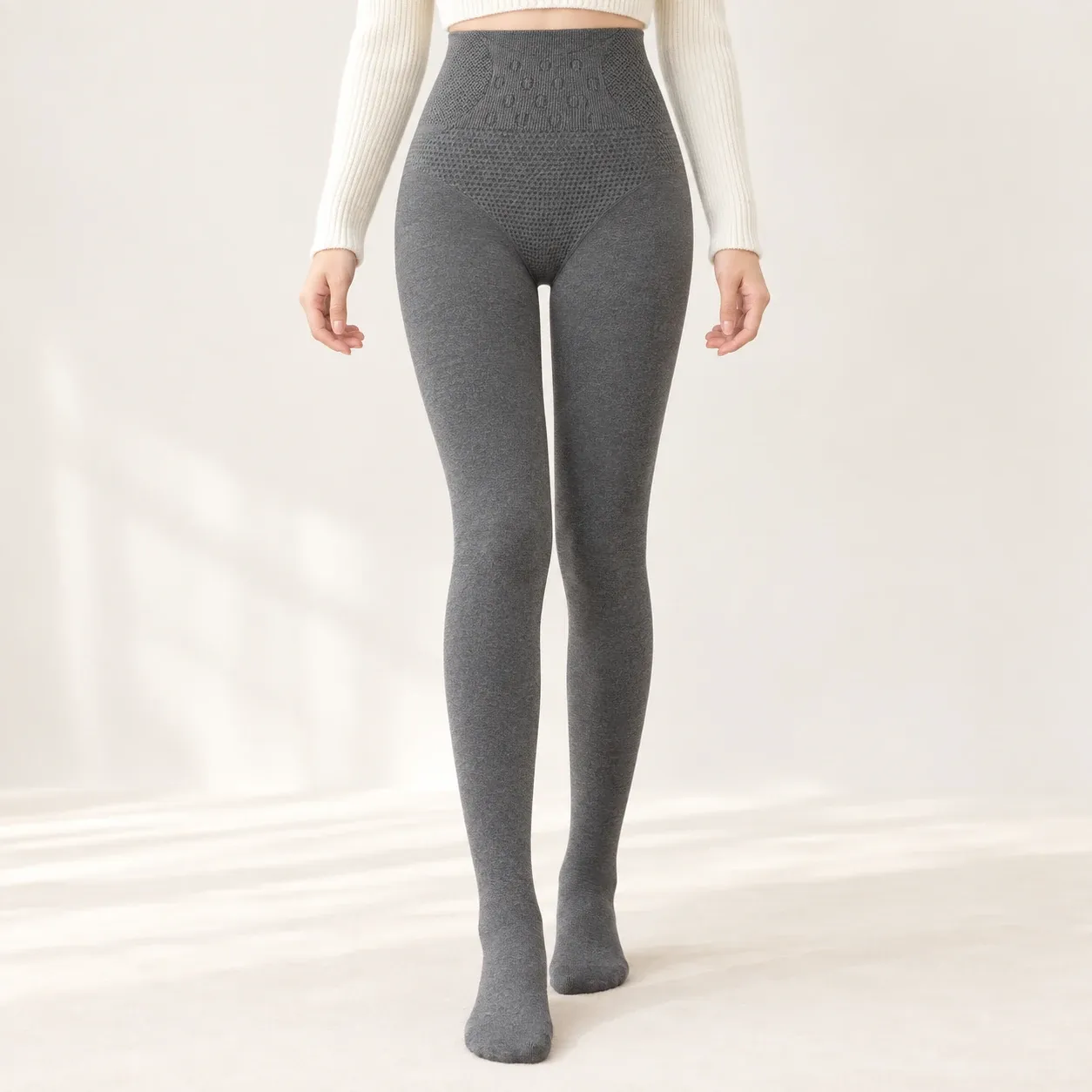 Front view of grey fleece-lined leggings showing the high waistband and full footed silhouette
