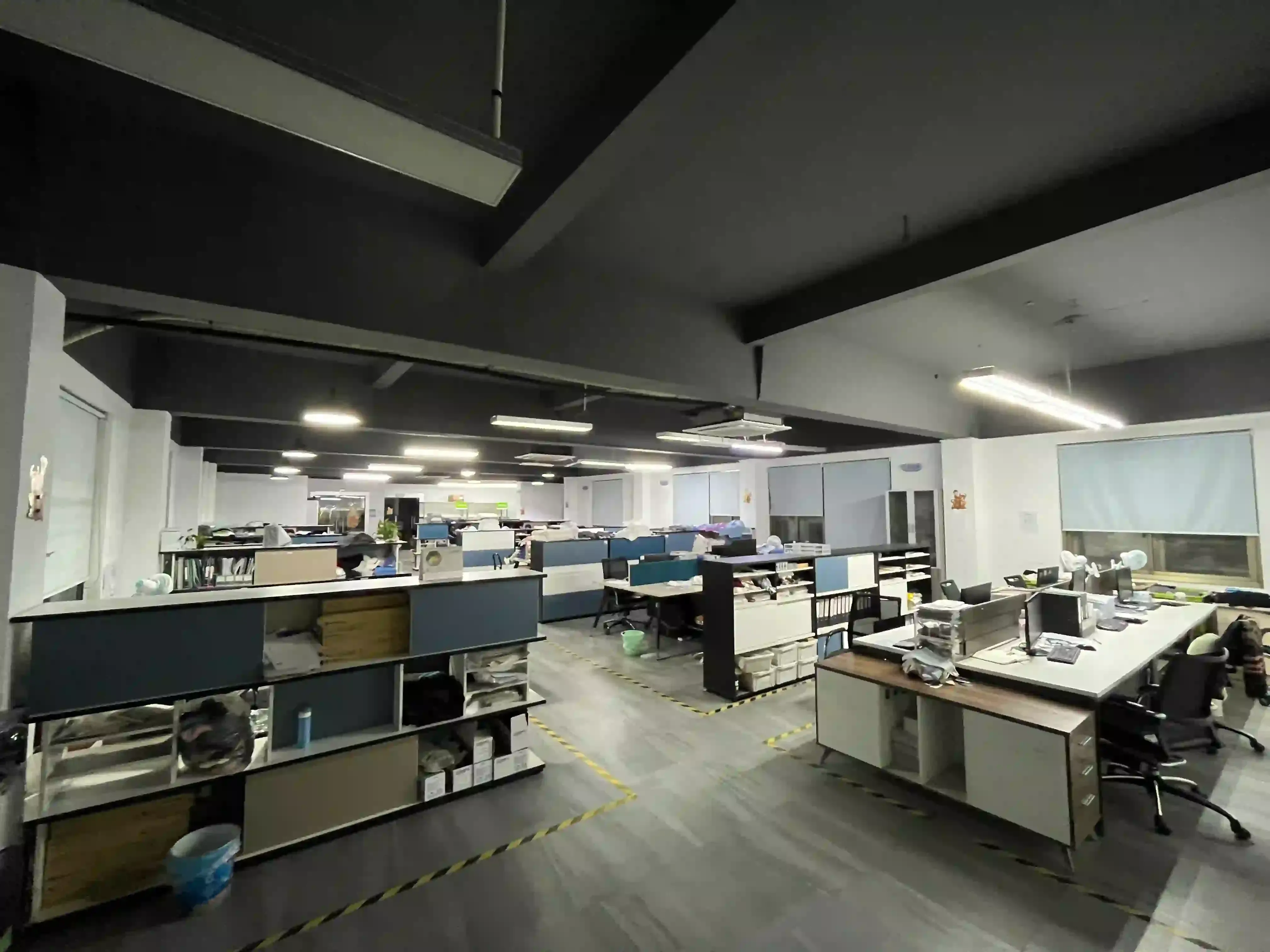 Office area of the knitwear factory with workstations, desks and computer monitors
