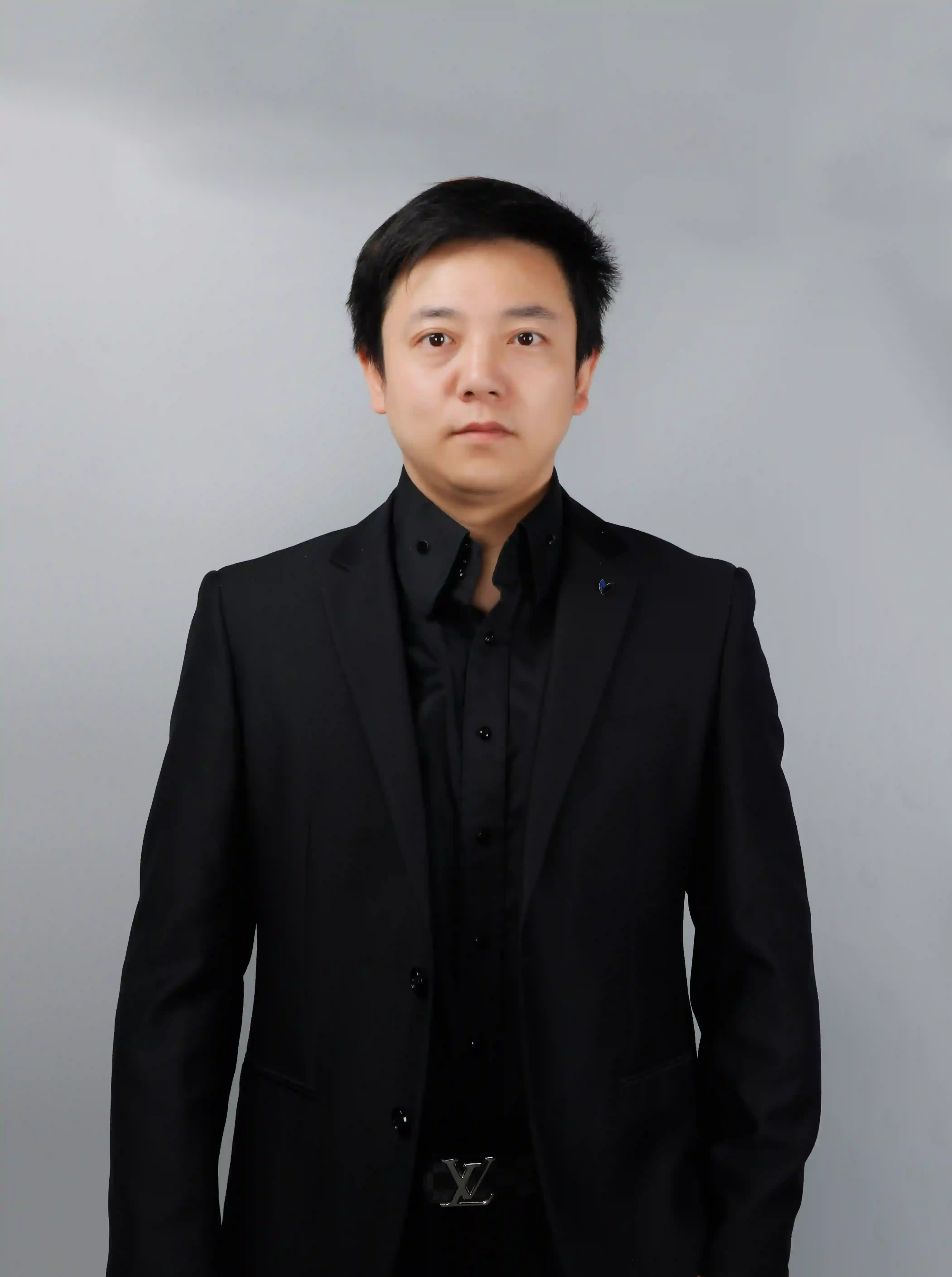 Portrait of an SML Intimate team member in a black suit