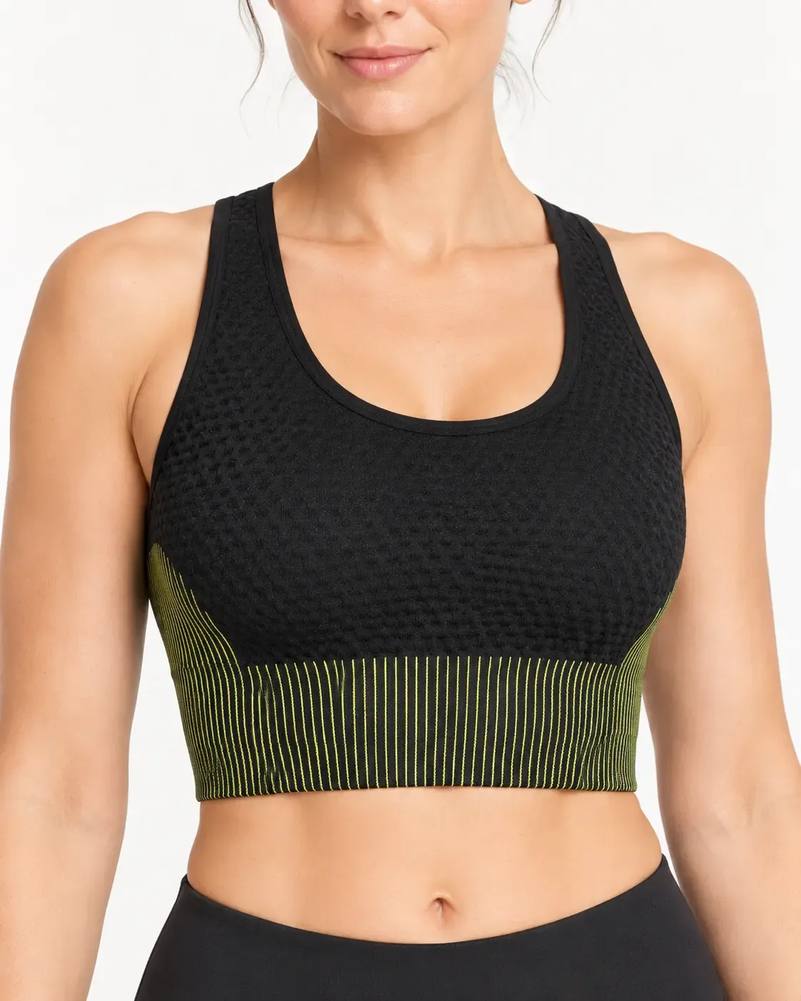 Close-up of seamless crop tank top with textured knit and olive ribbed underband
