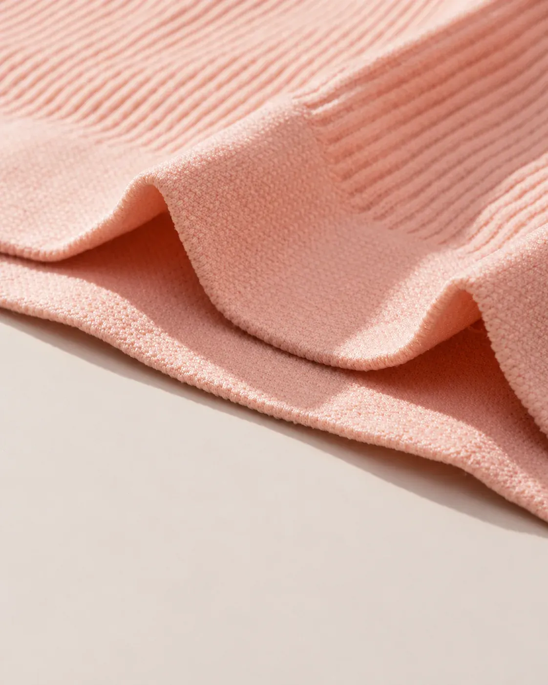Close-up view of seamless ribbed bikini brief fabric texture and stretch knit structure