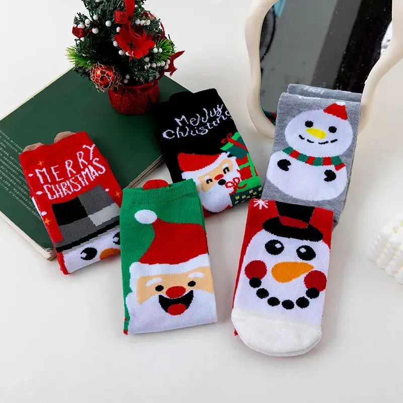 Christmas socks gift set displayed with a green gift box and festive decorations