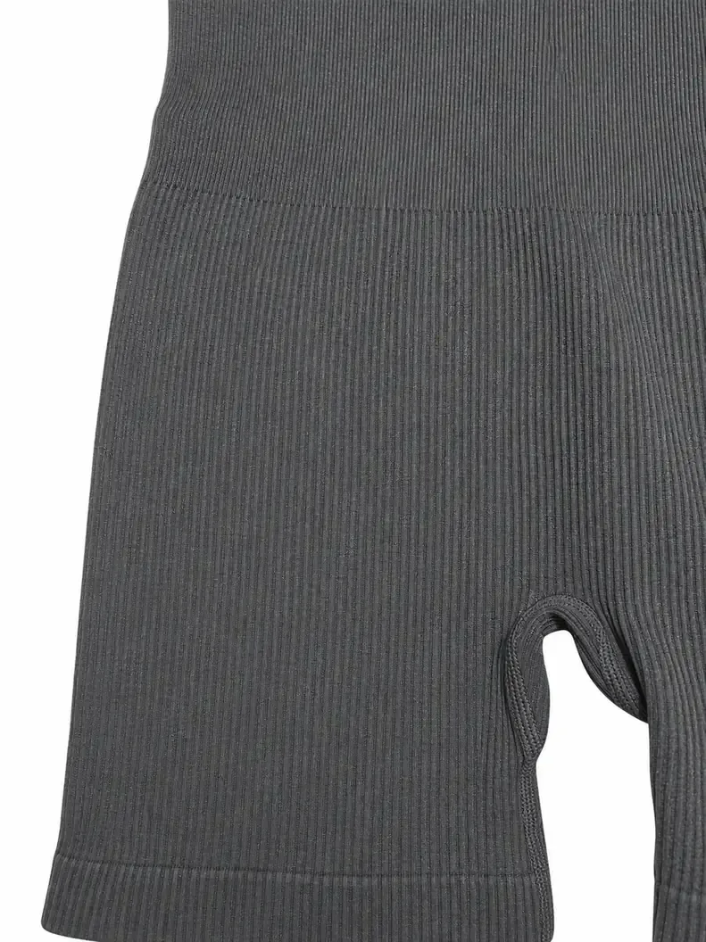 Close-up detail of rib knit texture on custom women's seamless high-neck short unitard