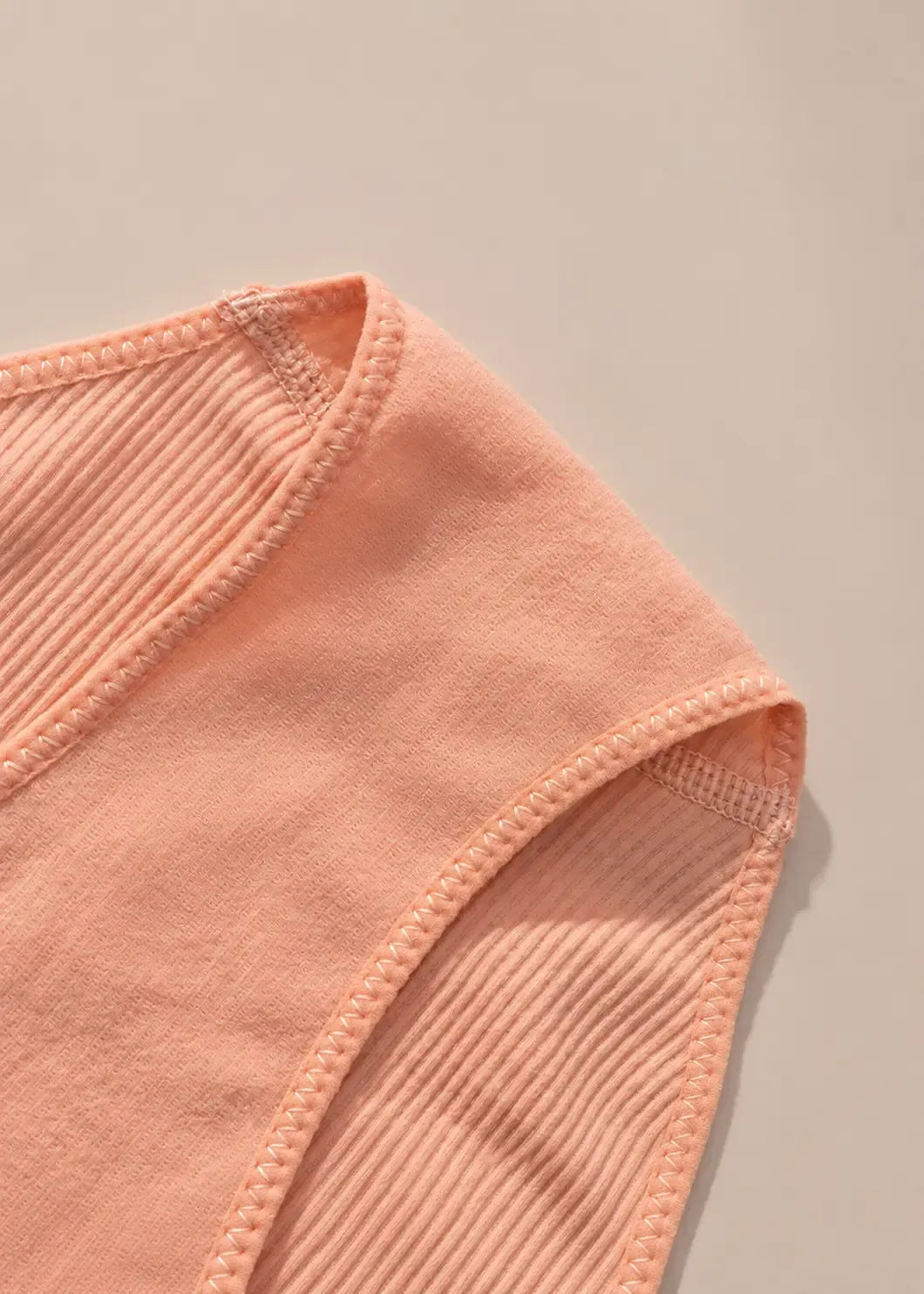 Inside view of seamless ribbed bikini brief showing inner gusset construction and stitching details