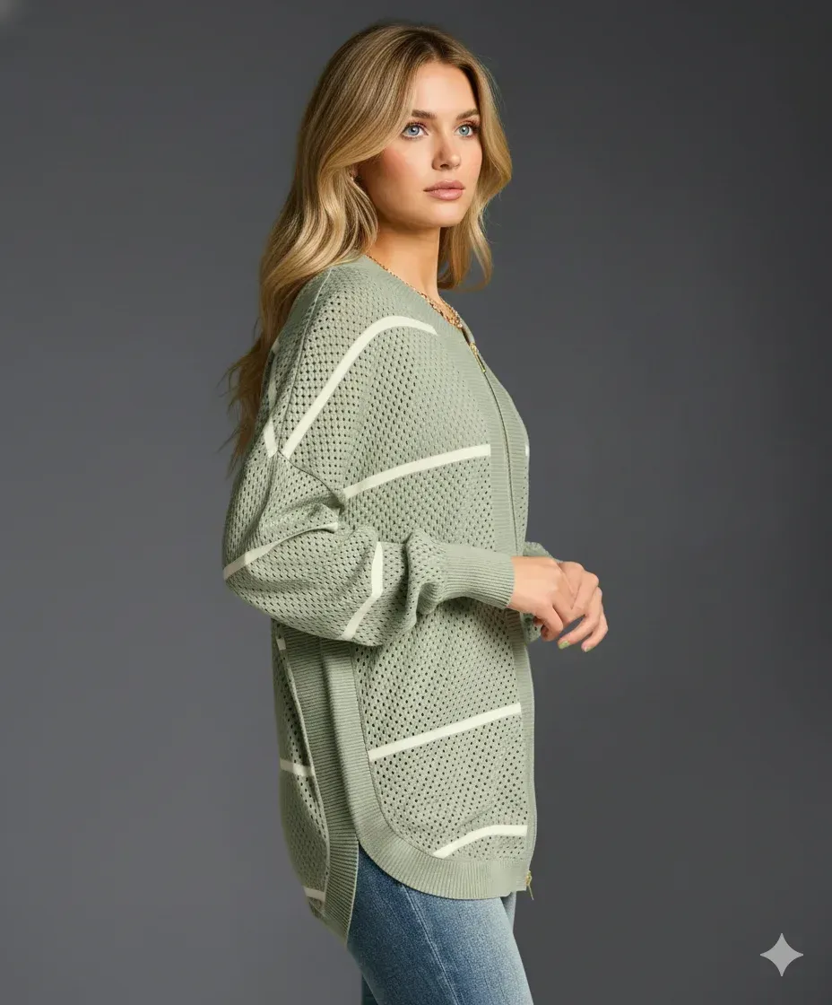 Side view of the sage green open-weave zip-front cotton cardigan showing the drop shoulder and striped pointelle knit