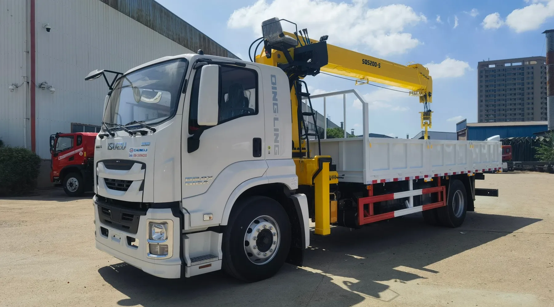 White Isuzu truck-mounted crane with a yellow SQS200 crane and a drop-side cargo body