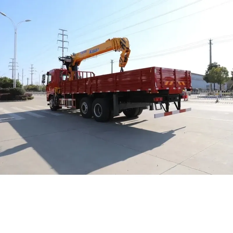 Rear three-quarter view of the red Dayun crane truck showing the drop-side cargo body and the lowered crane boom