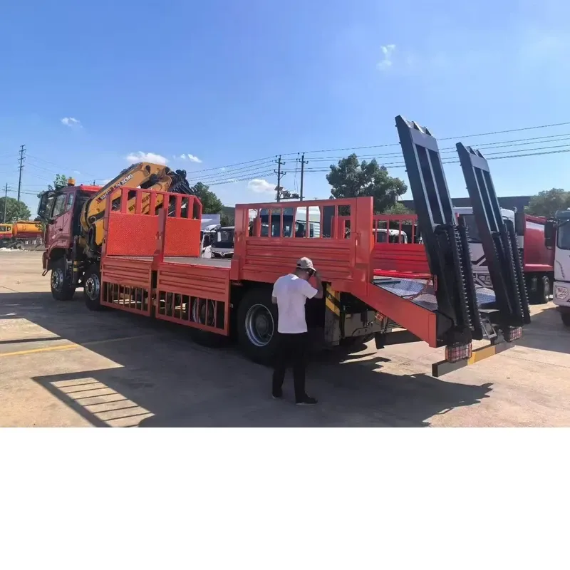HOWO 8x4 truck-mounted crane with the loading ramps folded down at the rear of the flat-bed body