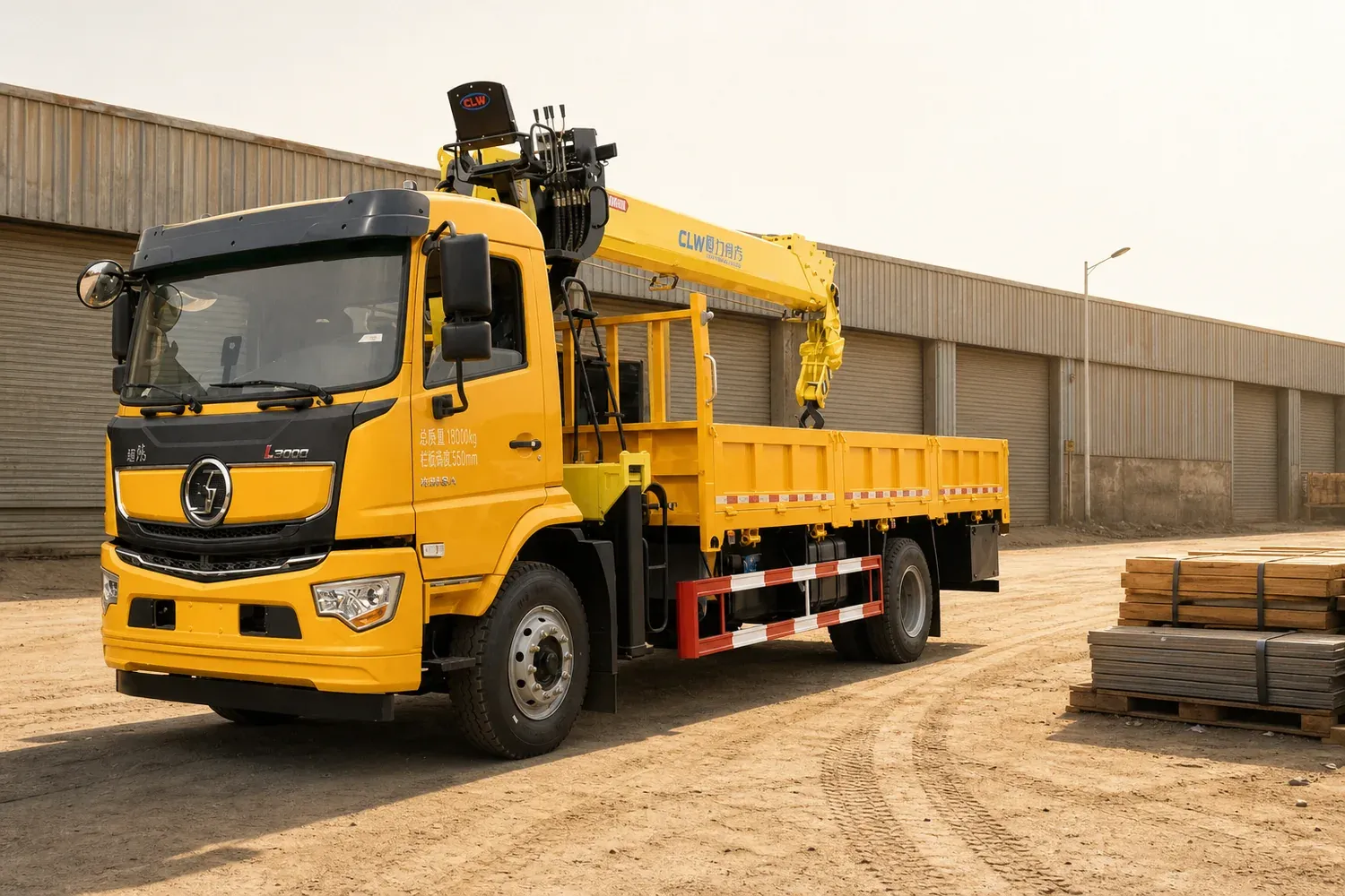 Truck-mounted crane lorry in a dusty industrial goods yard under hard afternoon sun, SASO conformity certificates Saudi Arabia