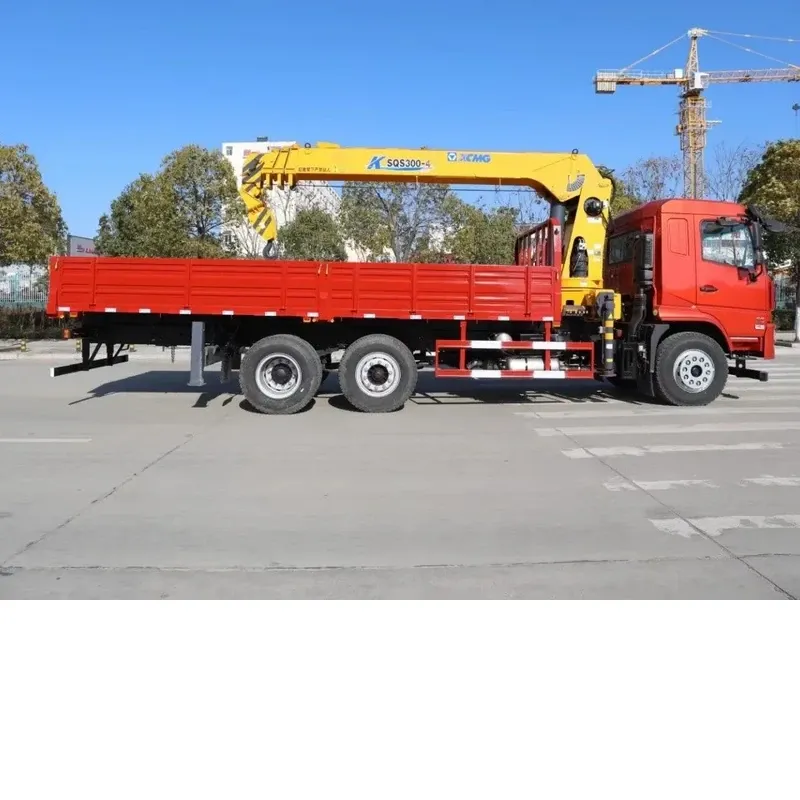 Side view of the red Dayun 6x2 crane truck with the yellow knuckle-boom crane stowed above the long cargo body