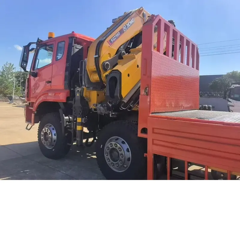 XCMG GSQZ560.6 knuckle-boom crane on the HOWO 8x4 chassis, close view of the crane column, front outrigger and flat-bed body