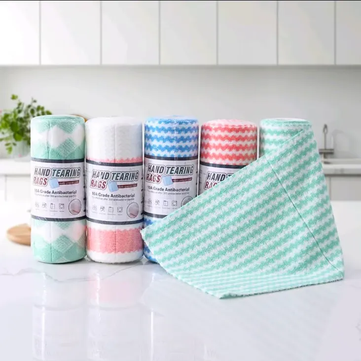 Textured tear-off cleaning cloth rolls in assorted colors beside a loose cloth section