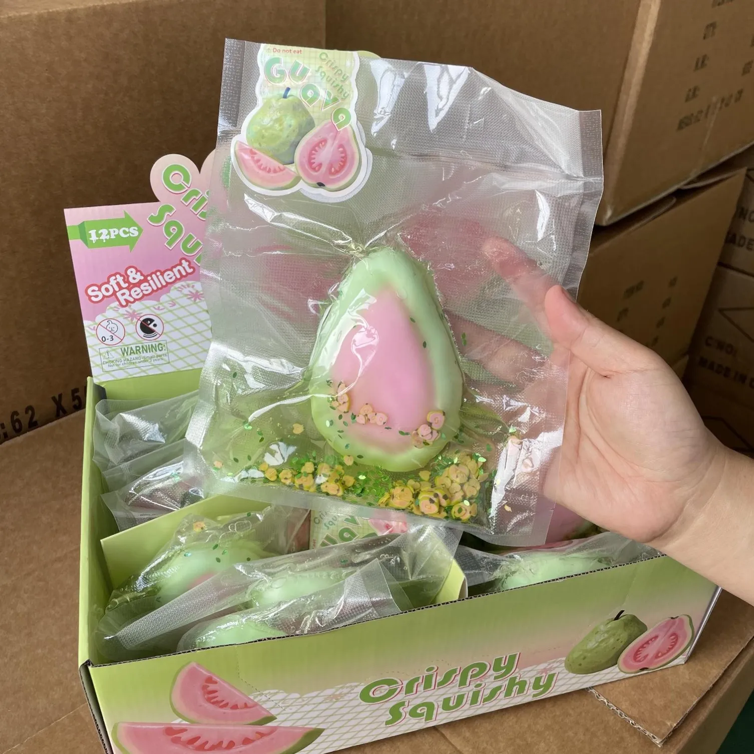 Guava-shaped squishy toy with display packaging