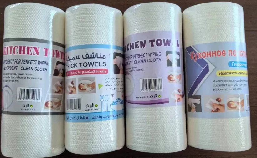 Four textured nonwoven kitchen wipe rolls with different printed wrappers