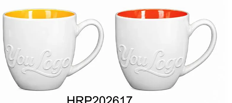 Two white ceramic mugs with raised Your Logo lettering and yellow or red interiors.