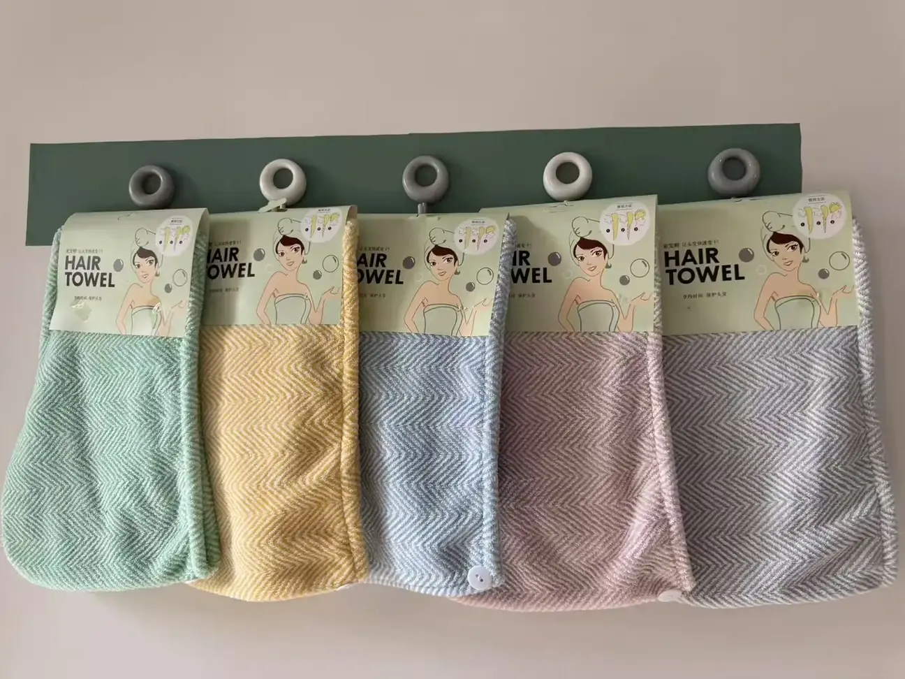 Textured hair towel wraps in pastel colors with retail hanging cards