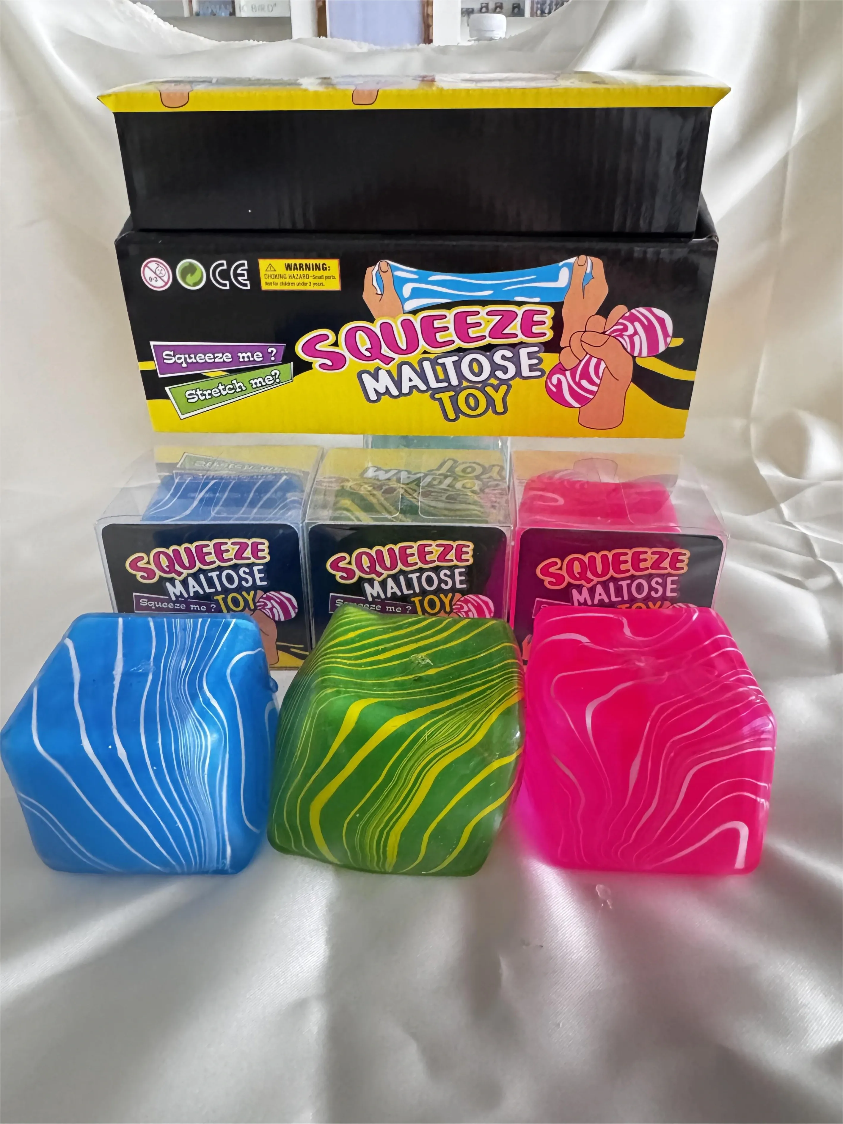 Colourful patterned squishy cubes with display packaging