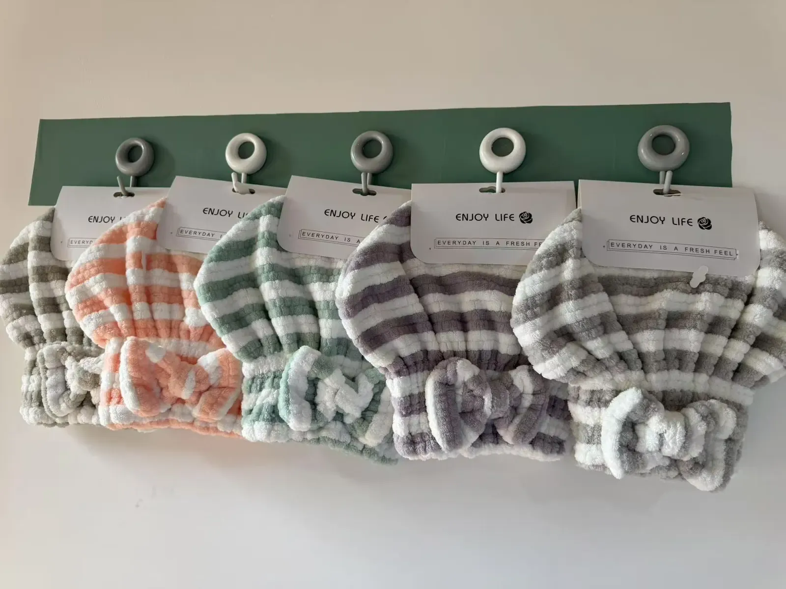 Compact hair towel caps with raised textures and gathered openings