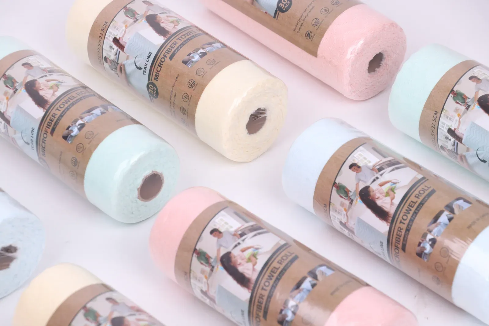 Pastel-colored cleaning cloth rolls arranged diagonally in retail wrapping