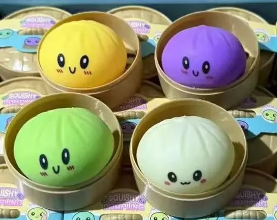 Colourful bun-shaped squishy toys in round tubs