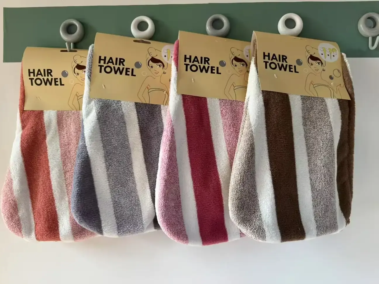 Wide-striped hair towel wraps in assorted colors with hanging cards