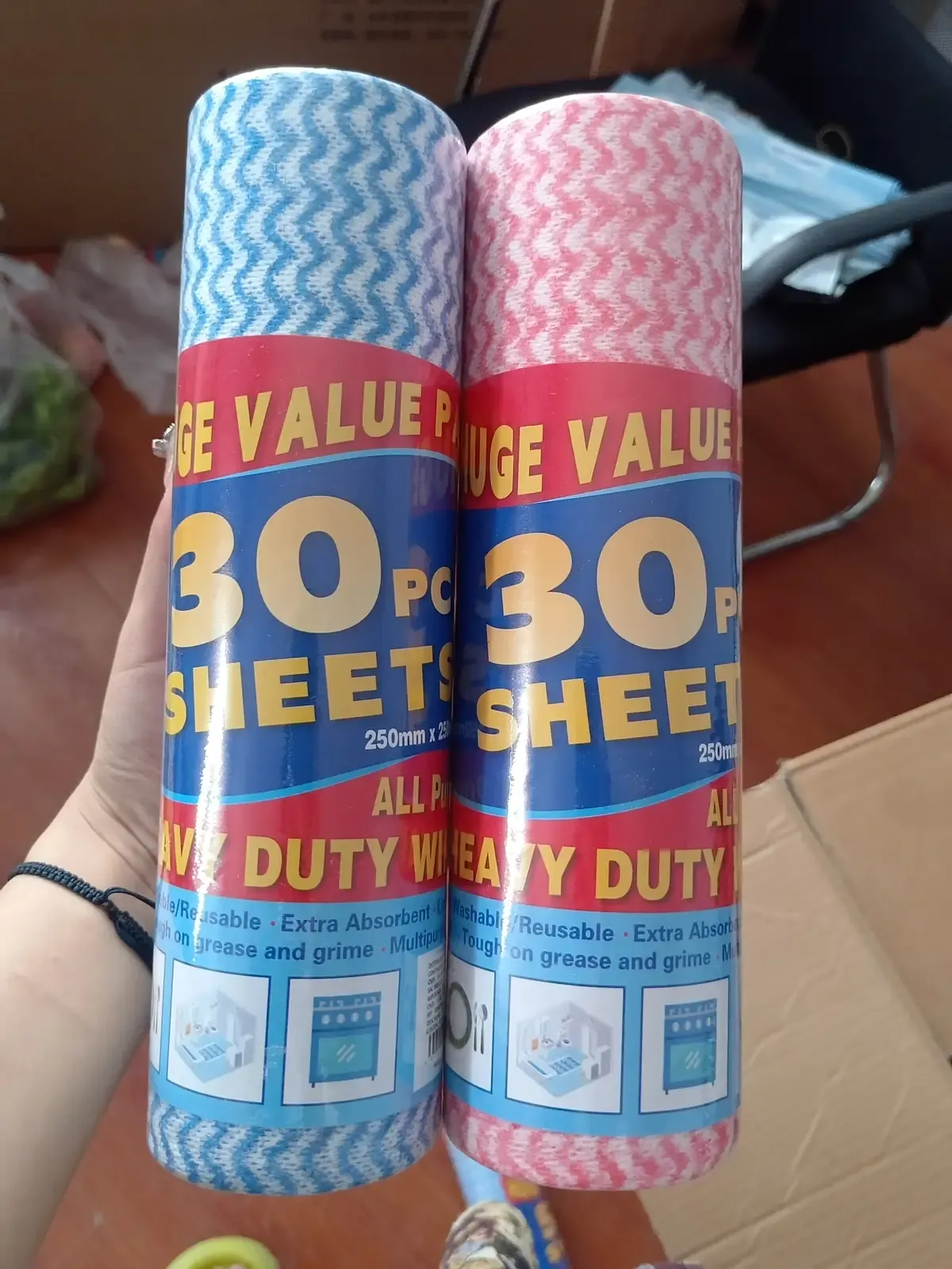 Blue and pink wave-patterned kitchen wipe rolls with 30-sheet packaging