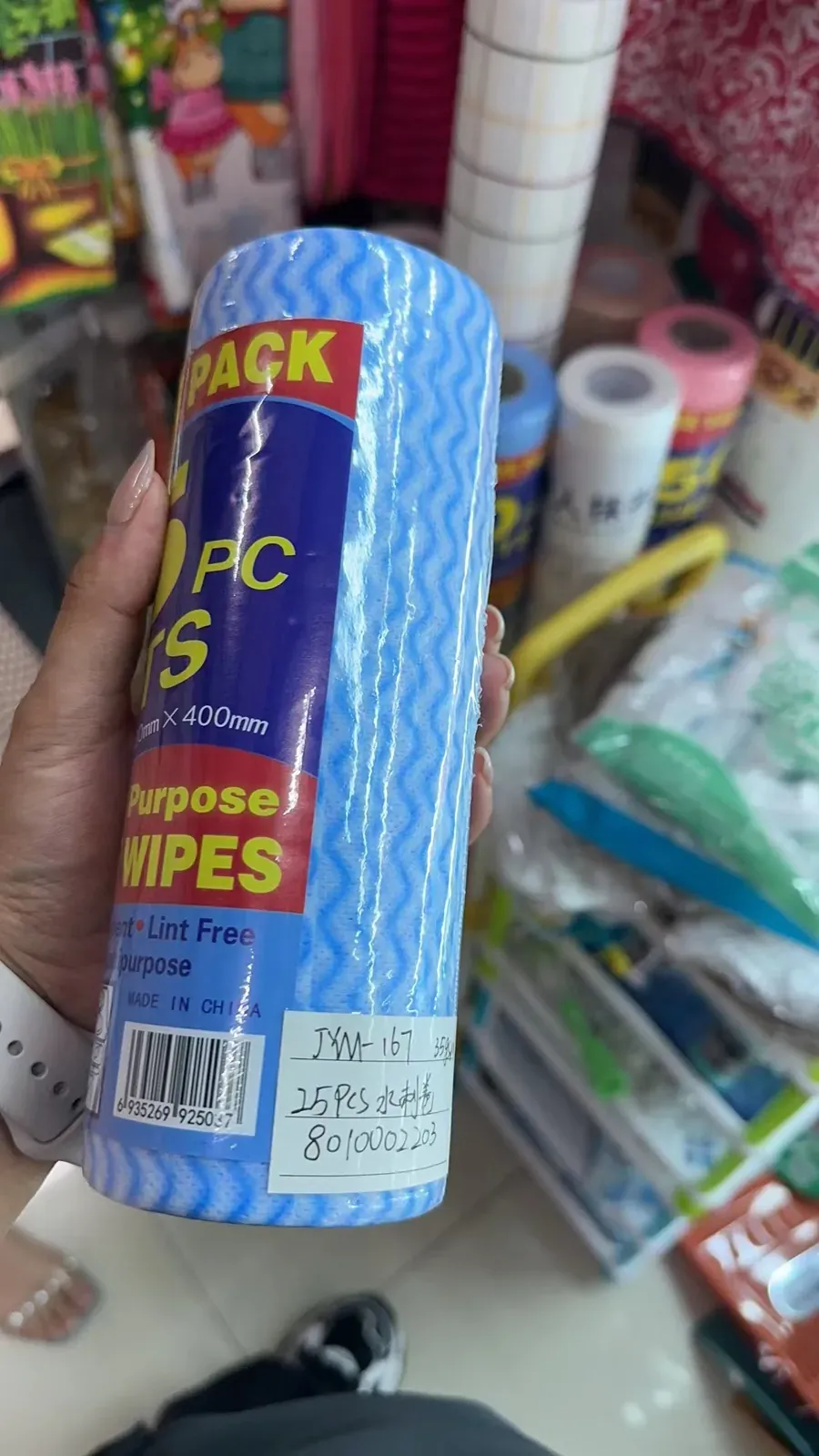 Packaged wave-patterned kitchen wipe rolls in assorted colors