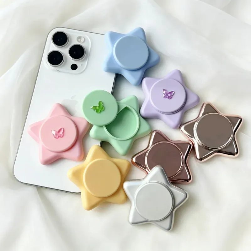 Star-shaped lip glosses arranged on white bedding