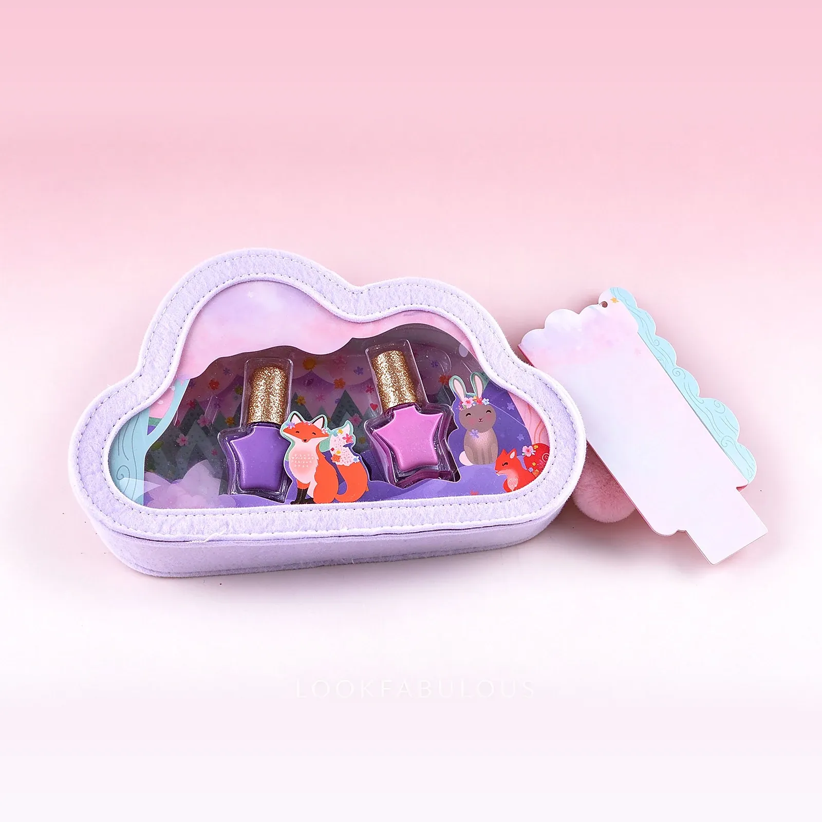 Two star shaped nail polishes in pink and purple with gold caps in a lilac cloud shaped pouch