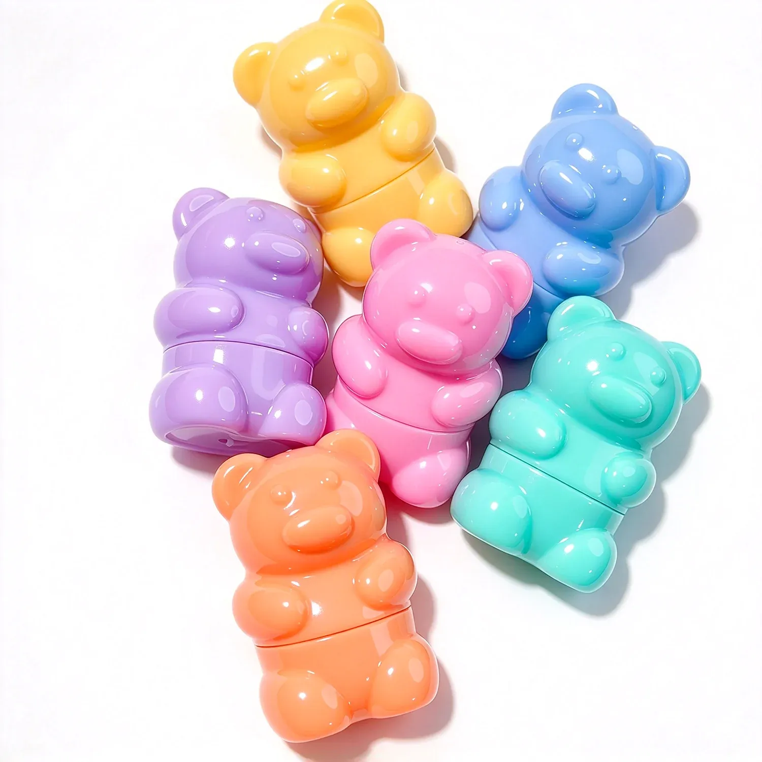 Gummy bear shaped glosses in yellow, blue, purple and orange
