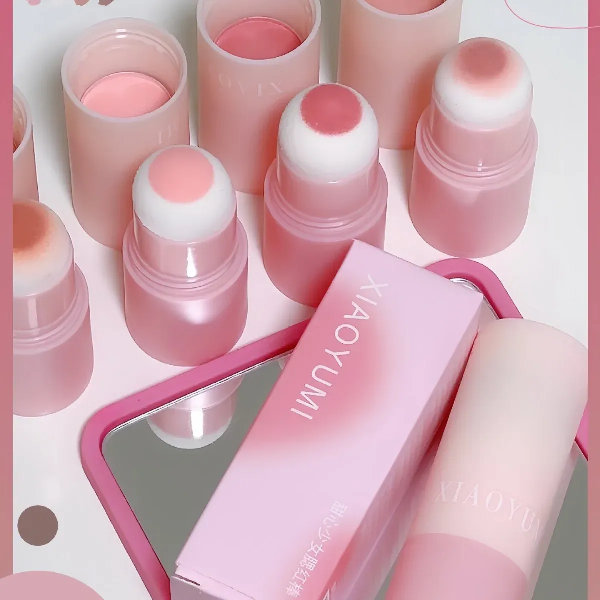 Cushion-tip solid blush sticks in soft pink cases with a gift box
